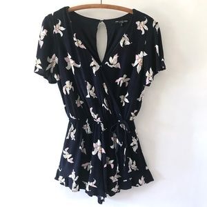 One Clothing Navy Floral Flutter Sleeve Romper with Ruffle Edge